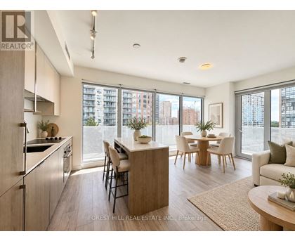 A modern kitchen with a dining table and chairs.