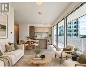 A living room with a couch, chairs, and a coffee table.