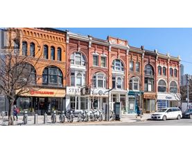 A row of old buildings with a bicycle parked in front of them.