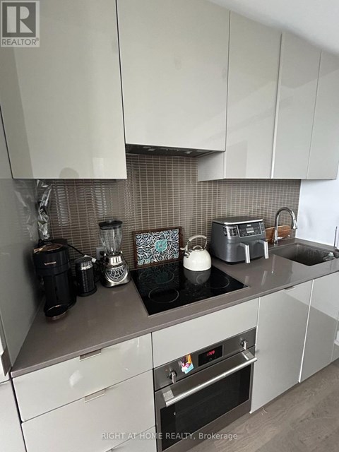 A kitchen with a stove top oven and a toaster.