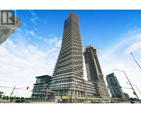 A modern skyscraper under construction with a unique triangular shape.