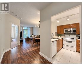 A brokerage image of a home with a kitchen and living room.