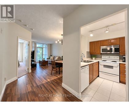 A brokerage image of a home with a kitchen and living room.