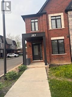 A brick building with the number 583 on the front.