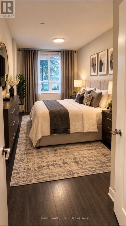 A bedroom with a large bed and a window with curtains.