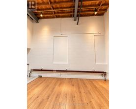 A room with wooden floors and white walls.