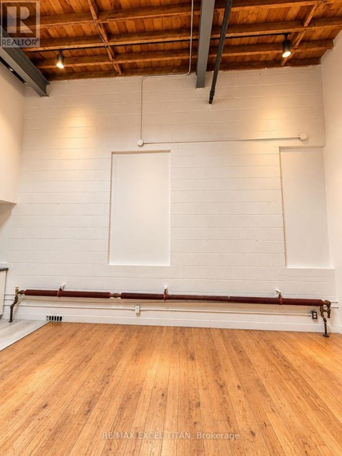 A room with wooden floors and white walls.