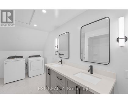 A bathroom with a sink, mirror, and toiletries.