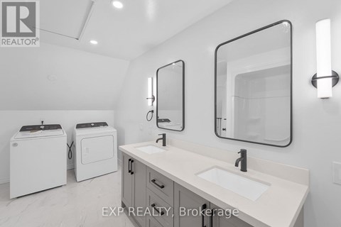 A bathroom with a sink, mirror, and toiletries.