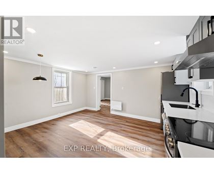 A kitchen with a sink and a window.