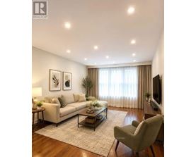 A living room with a couch, chair, and a coffee table.