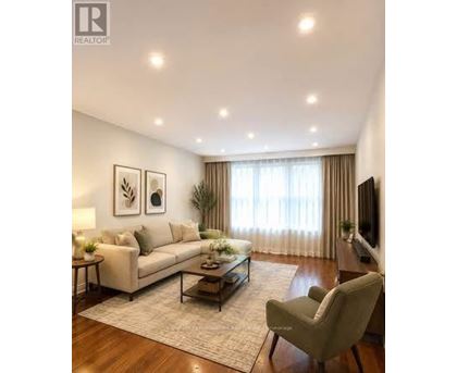 A living room with a couch, chair, and a coffee table.
