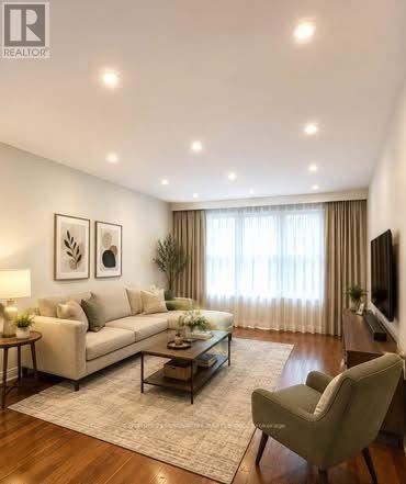 A living room with a couch, chair, and a coffee table.