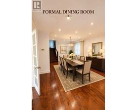 A formal dining room with a wooden table and chairs.