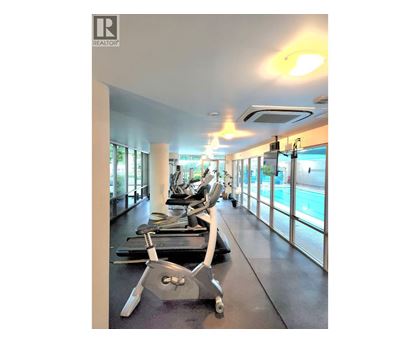 A gym with treadmills and exercise equipment.