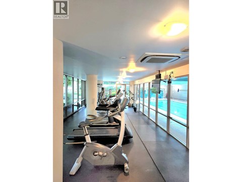 A gym with treadmills and exercise equipment.