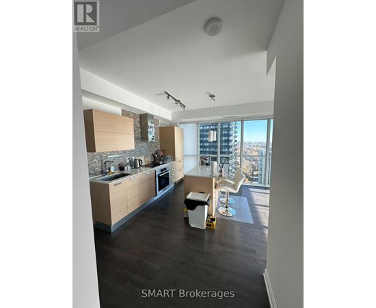 A modern kitchen with a view of the city.