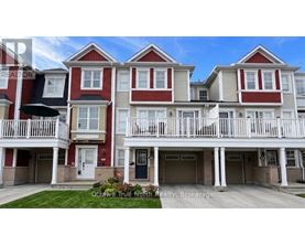 A row of townhouses with balconies and front doors.