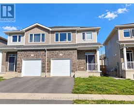 A two-story house with a garage is for sale.