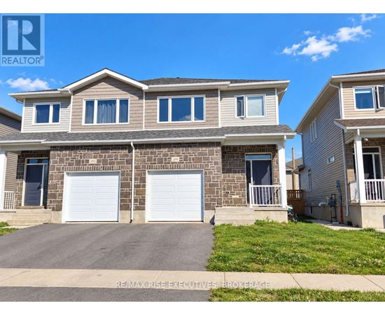 A two-story house with a garage is for sale.