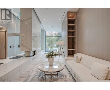 A modern living room with a white sofa and a marble floor.