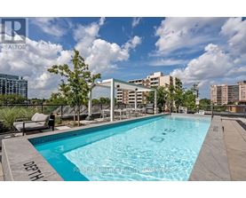 A swimming pool with the words "ReMax Alliance Realty Brokerage" written on the edge.