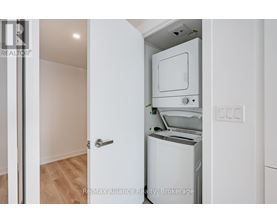 A white oven and dishwasher in a kitchen.