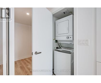 A white oven and dishwasher in a kitchen.