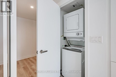 A white oven and dishwasher in a kitchen.