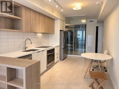 A kitchen with wooden cabinets and a white countertop.