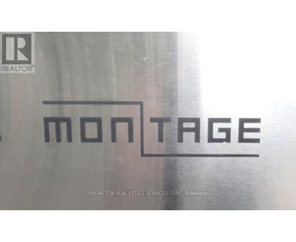 A logo for a real estate company is displayed on a glass window.