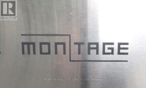 A logo for a real estate company is displayed on a glass window.