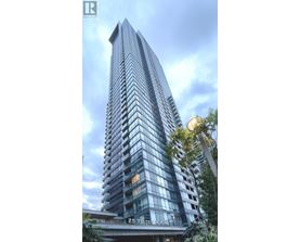 A tall building with many windows and balconies is shown in the image.