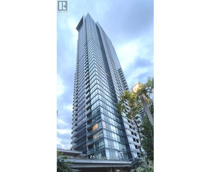 A tall building with many windows and balconies is shown in the image.