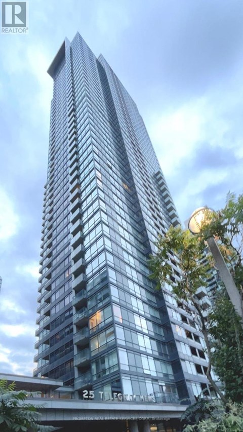 A tall building with many windows and balconies is shown in the image.