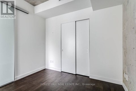A room with a white wall and a white door.