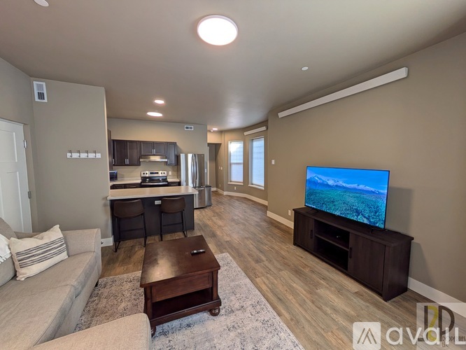 A living room with a television and a couch.