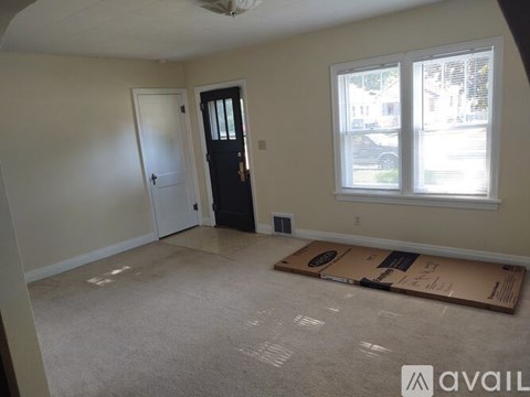A room with a door and a window is available for rent.