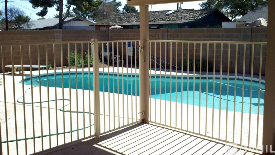 A pool behind a gate.