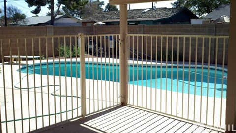 A pool behind a gate.