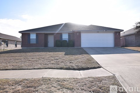 A house with a garage door is for sale.