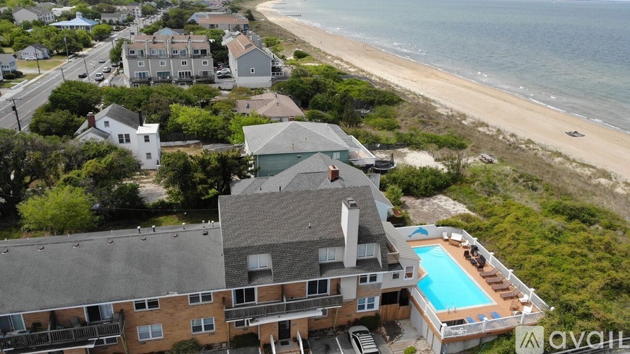 A beachfront property with a swimming pool is available for rent.