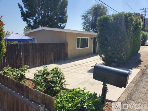 A house with a mailbox in front of it.