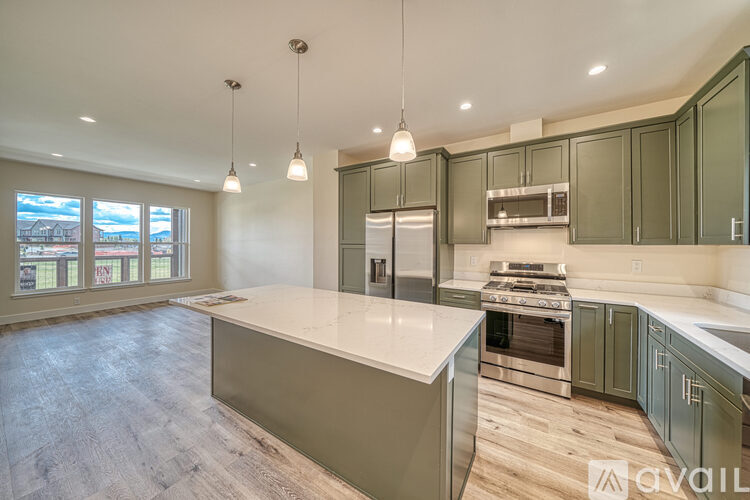 A kitchen with a large island in the middle.