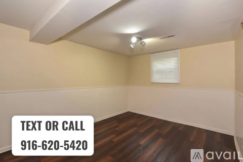 A room with a sign that says "TEXT OR CALL 916-620-5420" and a logo that says "AVAIL".