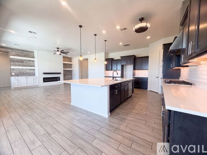 A modern kitchen with a large island in the middle.