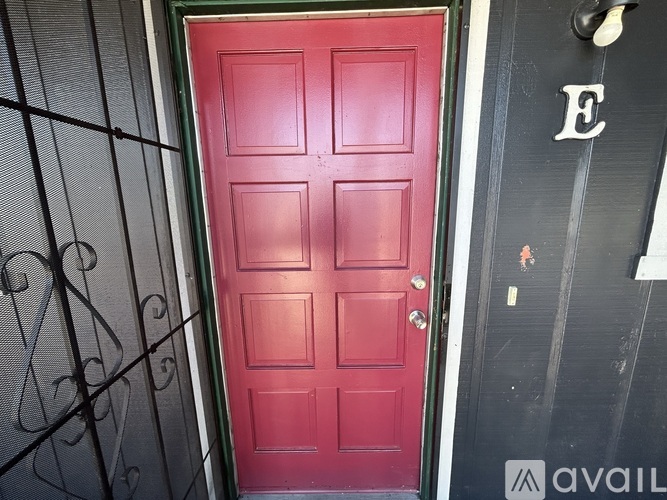 A red door is on the left and a black door is on the right.