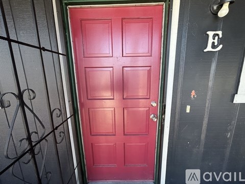 A red door is on the left and a black door is on the right.