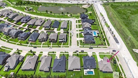 A suburban neighborhood with houses and a pool.