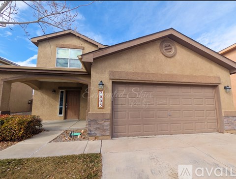 A house with a brown garage door is for sale.